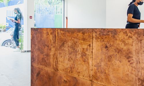Raw-Copper-and-pine-wood-Reception-Desk_08_NMBello-Studio_Olajide-Ayeni